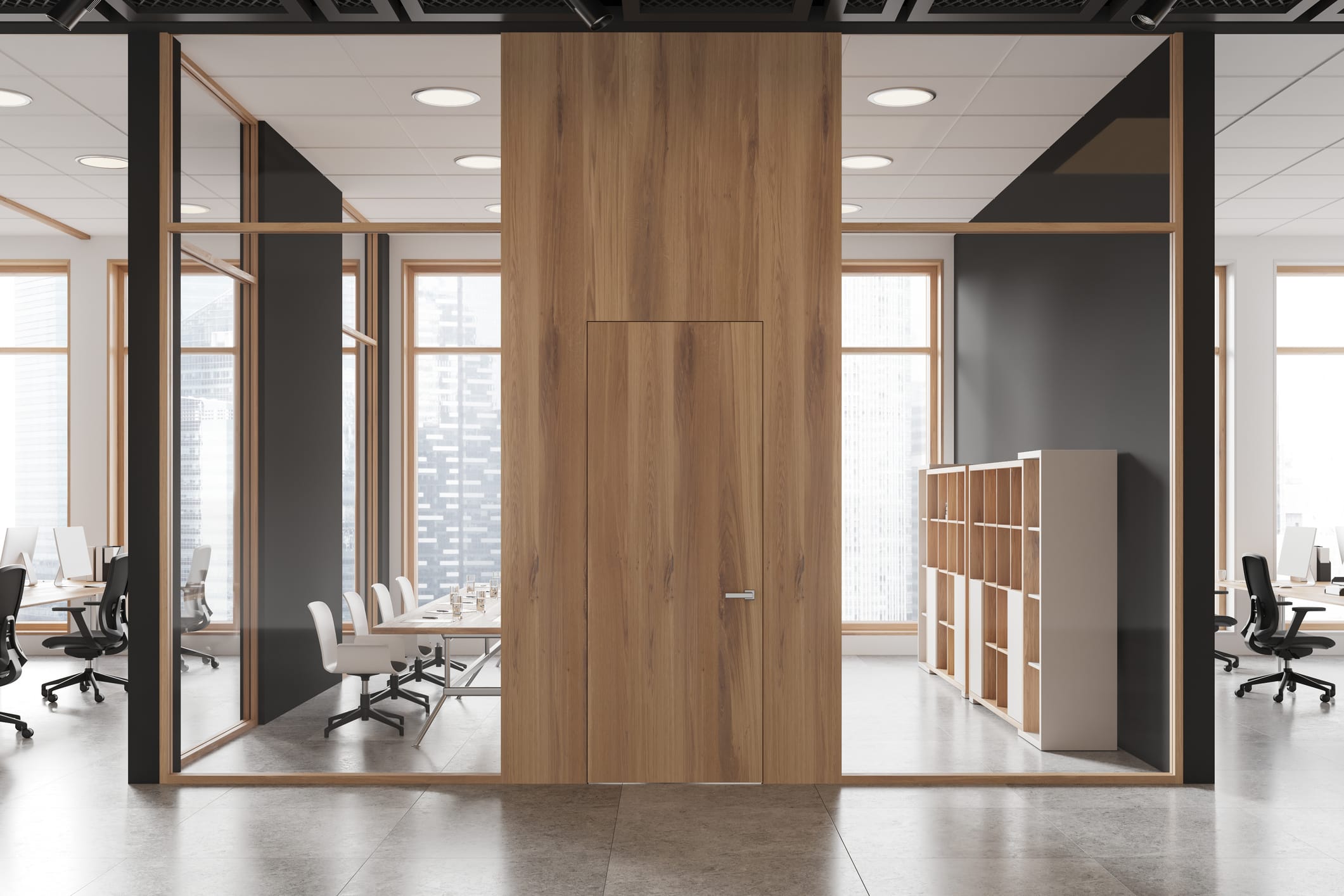 Modern wood office door with a minimalist flush design inside a contemporary glass-walled workspace.